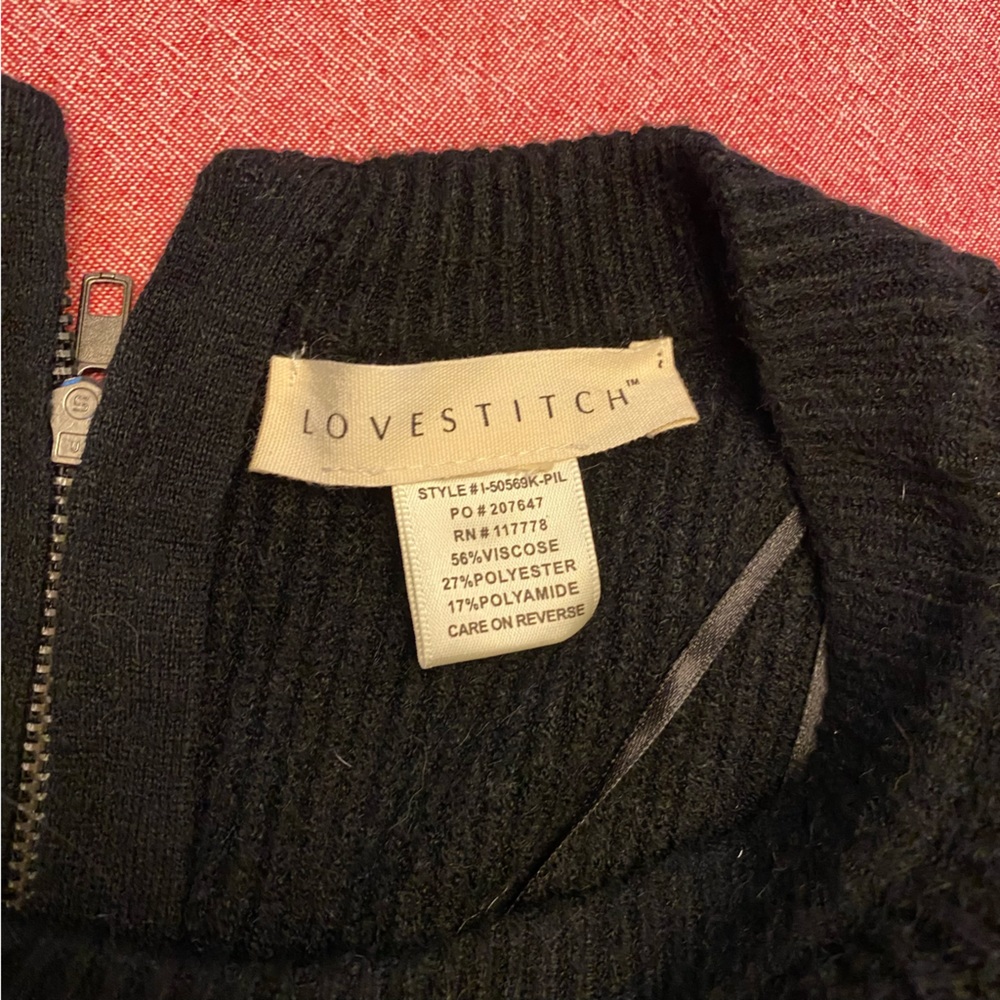 Zipper back sweater. Business in the front party in the back.